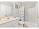 Bathroom with a white vanity, toilet, and a bathtub with shower combination at 15613 Glen Miro Dr, Huntersville, NC 28078