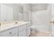 Clean bathroom with a white vanity, toilet, and shower/tub combination at 15613 Glen Miro Dr, Huntersville, NC 28078