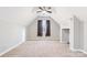 Spacious bonus room with a ceiling fan, carpet, and window at 15613 Glen Miro Dr, Huntersville, NC 28078