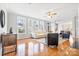 Bright living room features large windows, hardwood floors, and neutral decor at 15613 Glen Miro Dr, Huntersville, NC 28078