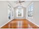 Bright sunroom with multiple windows and hardwood floors at 15613 Glen Miro Dr, Huntersville, NC 28078