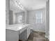 Clean bathroom, featuring a vanity with mirror and tiled floors at 16115 Preston Knoll Ln, Charlotte, NC 28215