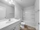 Clean bathroom with vanity, bathtub, and toilet at 16115 Preston Knoll Ln, Charlotte, NC 28215