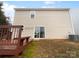 Rear view of house, deck, and small yard at 16115 Preston Knoll Ln, Charlotte, NC 28215