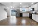 Modern kitchen with white cabinets, granite counters, and stainless steel appliances at 16115 Preston Knoll Ln, Charlotte, NC 28215