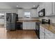 Modern kitchen with granite countertops and stainless steel appliances at 16115 Preston Knoll Ln, Charlotte, NC 28215