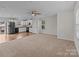 Open concept kitchen with stainless steel appliances and hardwood floor at 16115 Preston Knoll Ln, Charlotte, NC 28215