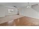 Spacious living room with hardwood and carpeted floors at 16115 Preston Knoll Ln, Charlotte, NC 28215