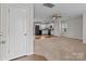 Open concept living room with kitchen view and neutral carpeting at 16115 Preston Knoll Ln, Charlotte, NC 28215