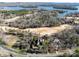 Aerial view of home on golf course near lake at 1629 Southpoint Ln, New London, NC 28127