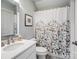 Simple bathroom with floral shower curtain at 1629 Southpoint Ln, New London, NC 28127