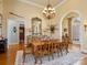 Formal dining room with chandelier and hardwood floors at 1629 Southpoint Ln, New London, NC 28127