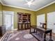 Bright home office with built-in bookcase and hardwood floors at 1629 Southpoint Ln, New London, NC 28127