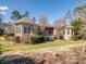 Brick home with stone pathway and landscaping at 1629 Southpoint Ln, New London, NC 28127