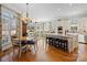 Kitchen with island, breakfast area, and hardwood floors at 1629 Southpoint Ln, New London, NC 28127