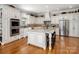 Eat-in kitchen featuring granite countertops, stainless steel appliances, and an abundance of cabinetry at 1629 Southpoint Ln, New London, NC 28127