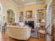 Living room with fireplace and built-in shelves at 1629 Southpoint Ln, New London, NC 28127