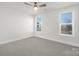 Spacious, bright bedroom with large windows, ample natural light and neutral carpeting at 1739 Dunloe St # 8242, Charlotte, NC 28206