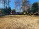 Large backyard with shed and mature trees at 210 Classic Ct, Mount Holly, NC 28120