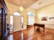 Grand living room with hardwood floors and piano at 210 Classic Ct, Mount Holly, NC 28120