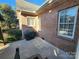 Brick patio with grill and plenty of space for entertaining at 210 Classic Ct, Mount Holly, NC 28120