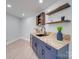 Basement bar with chevron countertops and blue cabinetry at 2143 Manawa Ln, Fort Mill, SC 29708