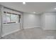 Basement bedroom with grey carpet and large window at 2143 Manawa Ln, Fort Mill, SC 29708