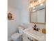 Small bathroom with single vanity and wood cabinets at 2143 Manawa Ln, Fort Mill, SC 29708