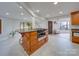 Kitchen island with granite countertops and wood cabinets at 2143 Manawa Ln, Fort Mill, SC 29708