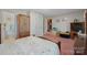 Bedroom with wooden bed frame and access to the bathroom at 2356 Ben Yount Ln, Vale, NC 28168