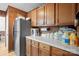 Kitchen with wood cabinets, stainless steel appliances, and ample counter space at 2356 Ben Yount Ln, Vale, NC 28168