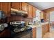 Kitchen with wood cabinets, stove, and ample counter space at 2356 Ben Yount Ln, Vale, NC 28168