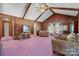 Spacious living room with vaulted ceiling, wood paneling, and plush seating at 2356 Ben Yount Ln, Vale, NC 28168