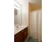 Clean bathroom with single vanity, shower, and linen closet at 2519 Early Flight Dr, Charlotte, NC 28262