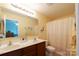 Clean bathroom with double sinks and a shower/tub combo at 2519 Early Flight Dr, Charlotte, NC 28262