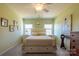 Bright bedroom with double bed, two nightstands, and large artwork at 2519 Early Flight Dr, Charlotte, NC 28262