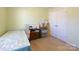 Small bedroom with twin bed, storage, and closet at 2519 Early Flight Dr, Charlotte, NC 28262