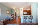 Bright dining area with hardwood floors and view of kitchen at 2519 Early Flight Dr, Charlotte, NC 28262