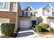 Two-story townhouse with a two-car garage and well-maintained landscaping at 2519 Early Flight Dr, Charlotte, NC 28262