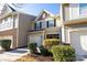 Two-story townhouse with a two-car garage and well-maintained landscaping at 2519 Early Flight Dr, Charlotte, NC 28262