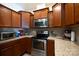 Kitchen with granite countertops and wood cabinets at 2519 Early Flight Dr, Charlotte, NC 28262