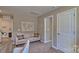 Relaxing sitting area with a neutral couch and world map at 3032 Ora Smith Rd, Lincolnton, NC 28092