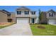 Charming two-story home featuring a two-car garage and well-maintained lawn in a suburban neighborhood at 3032 Ora Smith Rd, Lincolnton, NC 28092