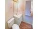 Clean bathroom with vanity, toilet, and updated fixtures at 310 Ann Baker Ct, Charlotte, NC 28217