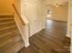 Bright entryway with stairs leading upstairs and wood-look floors at 310 Ann Baker Ct, Charlotte, NC 28217