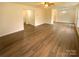 Bright living room with hardwood floors and access to the kitchen and stairs at 310 Ann Baker Ct, Charlotte, NC 28217