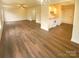 Open concept living and kitchen area with hardwood floors at 310 Ann Baker Ct, Charlotte, NC 28217