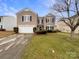 Two-story house with a garage and landscaped yard at 3418 Pikes Peak Dr, Gastonia, NC 28052