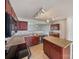 Well-lit kitchen features wood cabinets, neutral countertops, and an open design with sightlines to the living area at 3418 Pikes Peak Dr, Gastonia, NC 28052