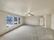 Large main bedroom with carpet and backyard view at 3418 Pikes Peak Dr, Gastonia, NC 28052